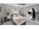 Cozy bedroom with a queen-size bed and a work area at 4822 W Bay Court Ave, Tampa, FL 33611