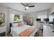 Bright bedroom with a comfortable bed, workspace, and window at 4822 W Bay Court Ave, Tampa, FL 33611