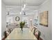 Dining area with a light table and view into the living room at 4822 W Bay Court Ave, Tampa, FL 33611