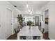 Bright dining room features a white table with six metal chairs at 4822 W Bay Court Ave, Tampa, FL 33611