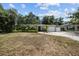 House exterior showcasing a spacious yard and driveway at 4822 W Bay Court Ave, Tampa, FL 33611