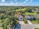 Aerial view of a house with a three-car garage and a large backyard at 4996 Felecity Way, Palm Harbor, FL 34685