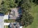 Top-down view of house, pool, and driveway at 4996 Felecity Way, Palm Harbor, FL 34685