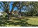 Home with a spacious backyard and mature trees at 4996 Felecity Way, Palm Harbor, FL 34685