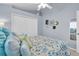 Bright bedroom with a queen-size bed and light blue walls at 4996 Felecity Way, Palm Harbor, FL 34685