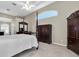 Bright bedroom featuring a comfortable bed, ample closet space, and a charming window seat at 4996 Felecity Way, Palm Harbor, FL 34685