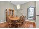 Formal dining room with hardwood floors and a wood table with chairs at 4996 Felecity Way, Palm Harbor, FL 34685