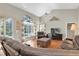 Relaxing living room with hardwood floors, sectional sofa, and pool view at 4996 Felecity Way, Palm Harbor, FL 34685