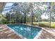 Inviting screened pool with ample surrounding deck space at 4996 Felecity Way, Palm Harbor, FL 34685