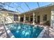 Enjoy this beautiful screened pool and lanai area at 4996 Felecity Way, Palm Harbor, FL 34685