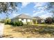 View of home's exterior, showcasing a well maintained lawn and neighboring houses at 5004 Brickell Park Cv, Bradenton, FL 34211