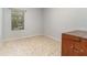 Simple bedroom with a window, tile floors, and closet at 5004 Brickell Park Cv, Bradenton, FL 34211