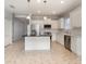 Modern kitchen with stainless steel appliances and white cabinets at 5004 Brickell Park Cv, Bradenton, FL 34211