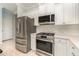 Modern kitchen with stainless steel appliances and white cabinets at 5004 Brickell Park Cv, Bradenton, FL 34211