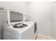 Laundry room with washer and dryer, and shelving at 5004 Brickell Park Cv, Bradenton, FL 34211