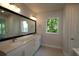 Modern bathroom with double vanity and large shower at 507 N Bradford Ave, Tampa, FL 33609