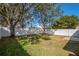 Backyard with grassy area and white fence at 5605 Tanagergrove Way, Lithia, FL 33547