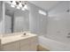 Bathroom with tub, vanity, and access to closet at 5605 Tanagergrove Way, Lithia, FL 33547