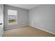 Bedroom with window, closet, and neutral colored walls at 5605 Tanagergrove Way, Lithia, FL 33547