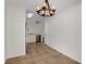 Dining area with chandelier and view into kitchen at 5605 Tanagergrove Way, Lithia, FL 33547