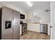 Kitchen with stainless steel appliances and light colored cabinets at 5605 Tanagergrove Way, Lithia, FL 33547