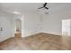 Open living space with tile floors and multiple access points to other rooms at 5605 Tanagergrove Way, Lithia, FL 33547