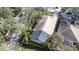 Aerial view of house with pool and screened enclosure at 6003 Tealside Ct, Lithia, FL 33547