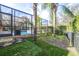 Landscaped backyard with artificial turf and trees at 6003 Tealside Ct, Lithia, FL 33547