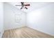 Bright bedroom featuring light wood flooring and ceiling fan at 6003 Tealside Ct, Lithia, FL 33547