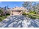 Two-story house with a two-car garage and basketball court at 6003 Tealside Ct, Lithia, FL 33547