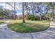 House with manicured lawn and curved sidewalk at 6003 Tealside Ct, Lithia, FL 33547