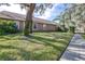 Single story home with mature landscaping at 6003 Tealside Ct, Lithia, FL 33547