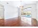 Bright living room with hardwood floors and sliding doors leading to a pool at 6003 Tealside Ct, Lithia, FL 33547