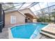 Relaxing screened pool with adjacent patio at 6003 Tealside Ct, Lithia, FL 33547