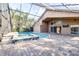 Screened pool and spa with brick pavers and a covered patio at 6003 Tealside Ct, Lithia, FL 33547