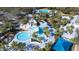 Aerial view of resort-style pool with water features and palm trees at 6003 Tealside Ct, Lithia, FL 33547