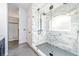 Large walk-in shower with marble tile and glass enclosure at 6003 Tealside Ct, Lithia, FL 33547