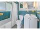 Bathroom with teal tile and white vanity at 6170 7Th N Ave, St Petersburg, FL 33710