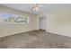 Large bedroom with neutral walls and carpet at 6170 7Th N Ave, St Petersburg, FL 33710