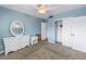 Bedroom with light blue walls and ceiling fan at 6170 7Th N Ave, St Petersburg, FL 33710