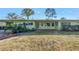 Mid-century modern home with covered entryway and lush landscaping at 6170 7Th N Ave, St Petersburg, FL 33710