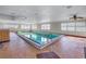 Indoor pool with tiled floor and ladder at 6170 7Th N Ave, St Petersburg, FL 33710