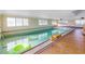 Long indoor pool with tiled floor at 6170 7Th N Ave, St Petersburg, FL 33710