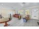 Living room with tiled floors, large windows, and a sofa at 6170 7Th N Ave, St Petersburg, FL 33710