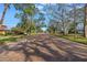 Brick paved street, mature trees, and single Gathering homes at 6170 7Th N Ave, St Petersburg, FL 33710