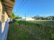 Backyard view with fence, grass and distant buildings at 6190 107Th N Ave, Pinellas Park, FL 33782