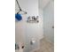 Simple bathroom with shower and storage shelf at 6190 107Th N Ave, Pinellas Park, FL 33782