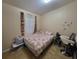 Bedroom with a double bed and floral bedding at 6190 107Th N Ave, Pinellas Park, FL 33782