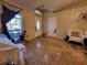 Living room with entryway view, tiled floors, and comfortable seating at 6190 107Th N Ave, Pinellas Park, FL 33782