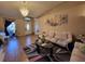 Living room with white sofas, a coffee table, and a view of the entryway at 6190 107Th N Ave, Pinellas Park, FL 33782